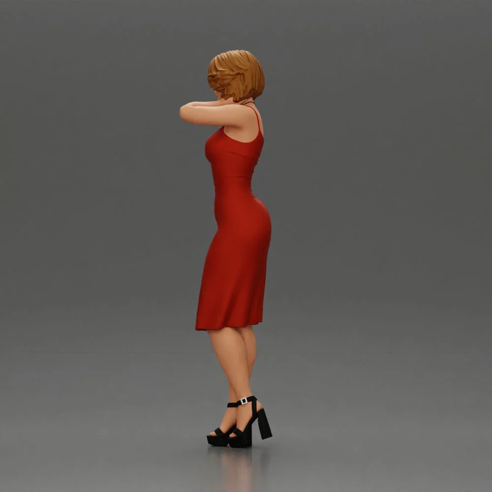 beautiful girl in a mini dress and heels with short hair places her hand on her neck - Image 5