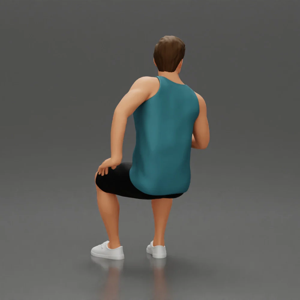 man sitting holding a can and wearing a tank top and shorts - Image 4