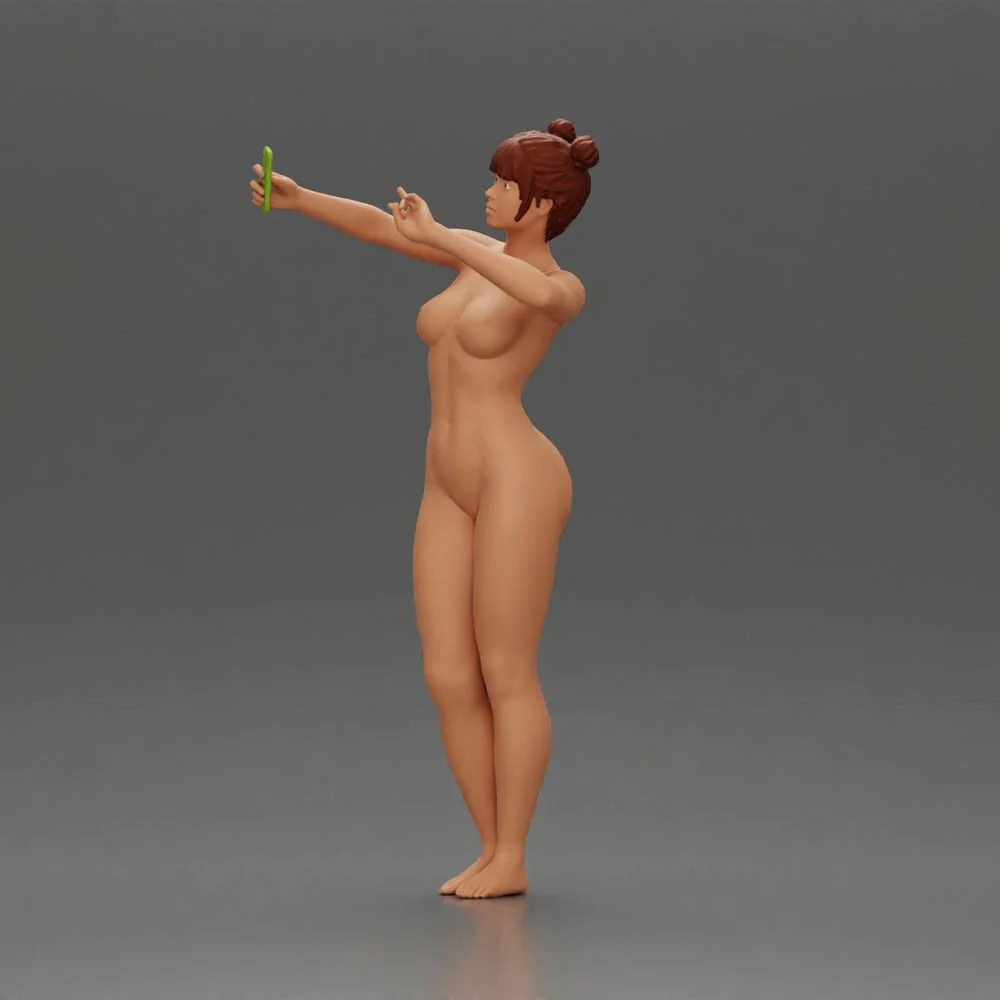 Naked woman taking a selfie with her phone on the beach - Image 5